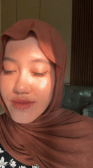 Woman demonstrates false eyelashes in Gadingrejo, Indonesia