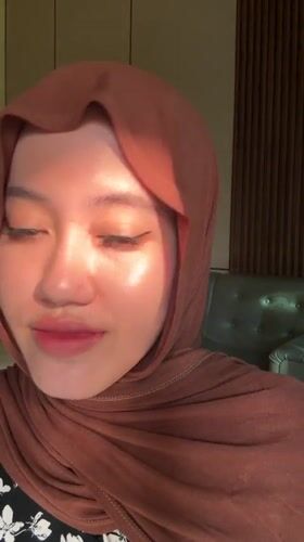 Woman demonstrates false eyelashes in Gadingrejo, Indonesia
