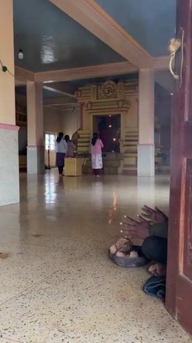 Man prays at Hindu temple in Sri Lanka mountains