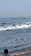 Kuta Beach surf session with boards, waves, and beachside downtime