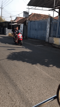 Everyday street traffic and street vendors in East Java