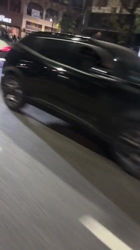 Nighttime street scene captured in Buenos Aires shows disabled vehicle