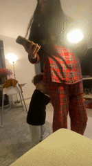 Woman takes casual mirror selfies at home in pajamas