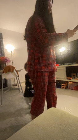 Woman takes casual mirror selfies at home in pajamas