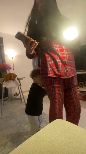 Woman takes casual mirror selfies at home in pajamas