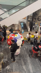 Trading card enthusiasts exchange soccer cards at Puebla mall