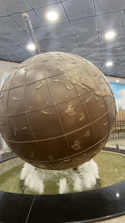 Man feeds squirrel as ducks gather in Yekaterinburg park