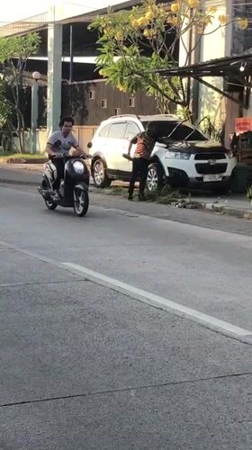 Afternoon traffic flows through a busy street in Boro, Indonesia