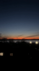 Sunset observed in Chaikovsky, Russia displays vibrant orange-blue gradient