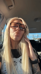 Woman films selfies in car in Plovdiv, Bulgaria