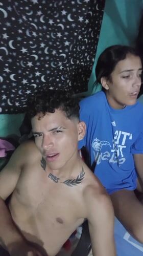 Young couple photographed together indoors in Altagracia, Venezuela