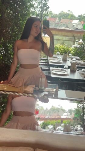Woman takes selfies at Thai restaurant in Choeng Thale
