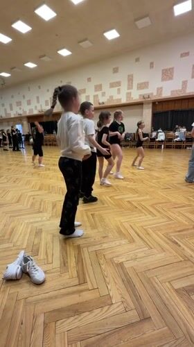 Children's dance practice session documented in Riga facility