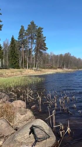 Visitor documents scenic lake views in Aleksandrovka, Russia