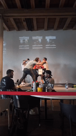 Arm wrestling competition in Romanshorn with multiple matches and referees