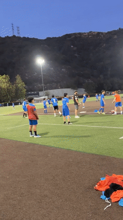 Evening soccer practice on a lit field in Glendale