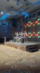 Three drummers perform coordinated set in Moscow ballroom