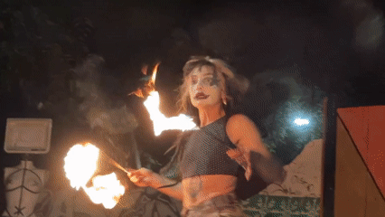 Fire dancer performs street art show in Milan
