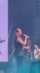 Red-haired performer takes stage in Krasnoyarsk wearing black outfit