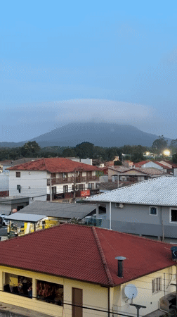 Florianópolis resident documents evening townscape and decorative weather vane
