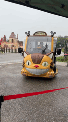Totoro-shaped electric shuttle parked and boarded in Nagakute
