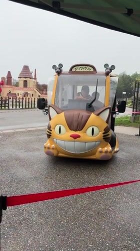 Totoro-shaped electric shuttle parked and boarded in Nagakute