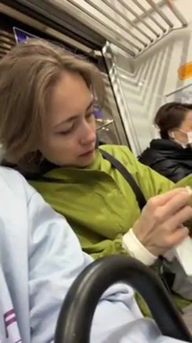 Commuter cleans hands with tissue on Tokyo train