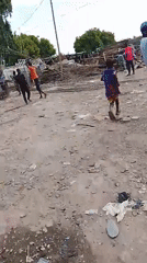 Routine street activities observed in Abuja marketplace, car repair