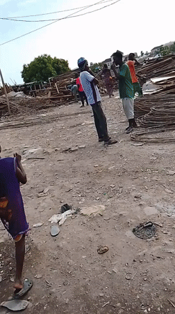 Routine street activities observed in Abuja marketplace, car repair