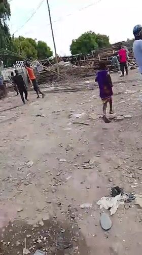 Routine street activities observed in Abuja marketplace, car repair