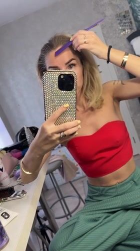 Woman documents beauty routine in Abakan dressing room
