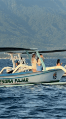Outrigger boat 'Pesona Fajar' carries passengers near Seririt, Indonesia