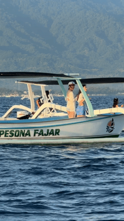Outrigger boat 'Pesona Fajar' carries passengers near Seririt, Indonesia