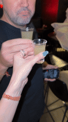 Two people toast with shots at Baan Lamai bar