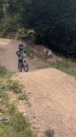 Mountain biking and cable cars at Molveno on a summer morning