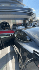 Tesla charging session documented outside modern West Hollywood building
