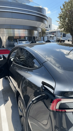Tesla charging session documented outside modern West Hollywood building