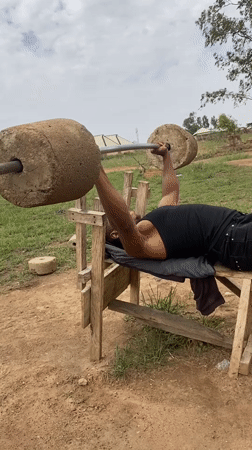 Men use homemade weights for outdoor workout in Nigeria