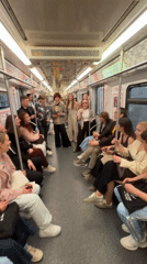 Young commuters stage singing performance on Moscow subway