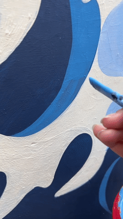 Artists paint ocean wave mural in Kediri, Indonesia