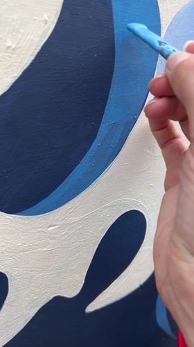 Artists paint ocean wave mural in Kediri, Indonesia
