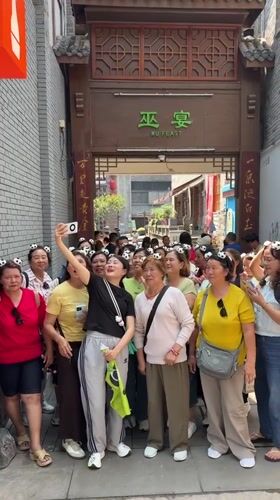 Women in panda accessories gather for photos in Chongqing