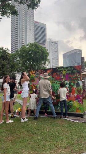 Group spray-paints structure at Singapore park Saturday morning