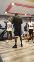 Casual gym session caught mid-workout