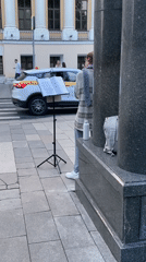 Street musician performs amid spring blossoms in Moscow evening