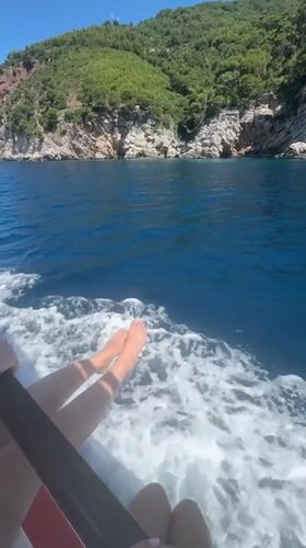 Relaxed boat ride along Montenegro's rugged green coastline
