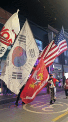 Nighttime flag procession draws crowds in Daegu, South Korea