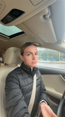Woman in Calvin Klein jacket observed in car in Tbilisi