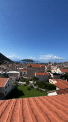 Morning Views Document Budva's Red-Roofed Coastal Cityscape