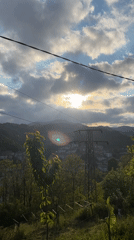 Spring flowers bloom overlooking mountain town in Bulgaria